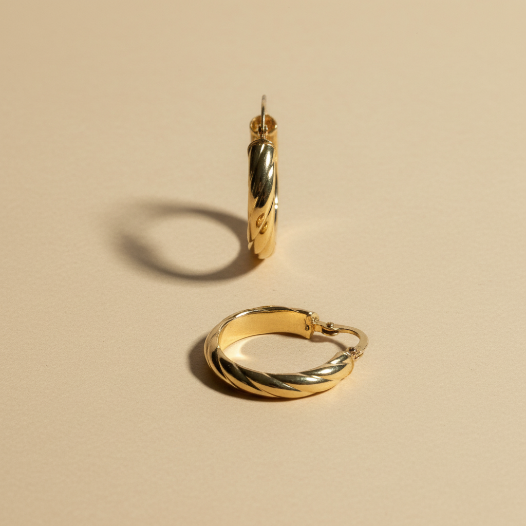 Aretes argolla torcidos en oro 18K - foto de catálogo