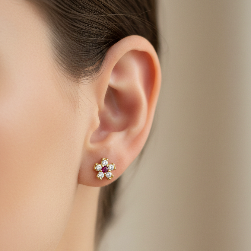 Aretes con rubí en oreja de mujer 0.5cm