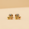 Aretes corazones tricolor 18k sin piedra negra