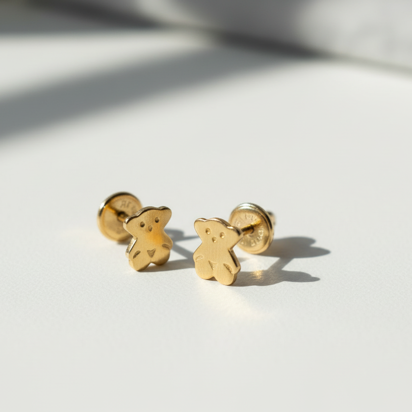 Aretes de niño en oro 18k con topo de seguridad