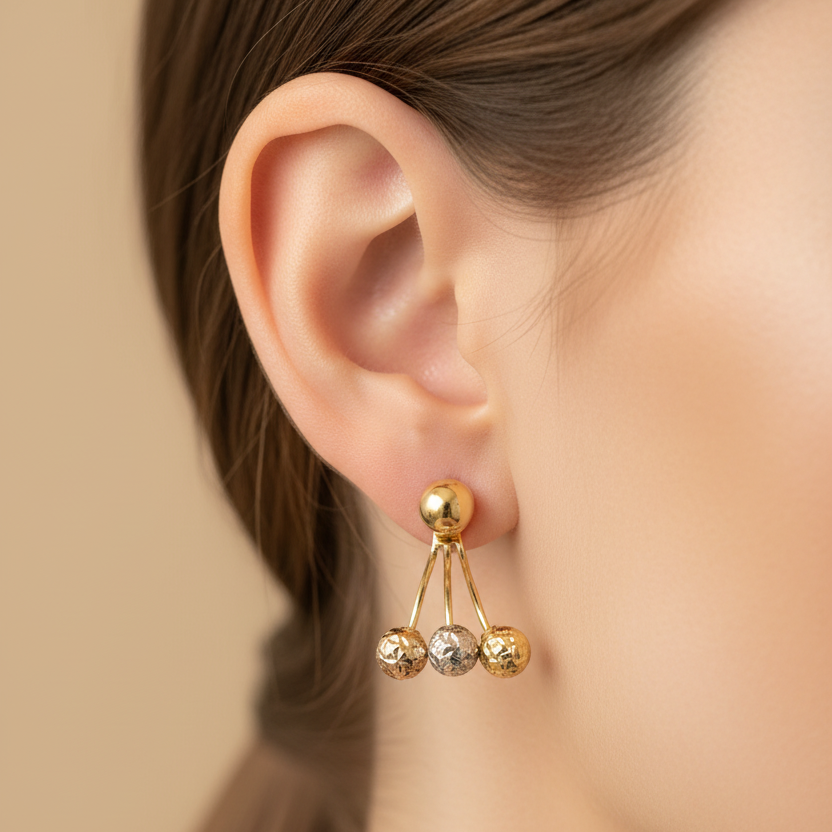 Aretes de oro 18K en oreja