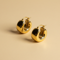 Aretes de oro 18K tipo aro grueso catálogo