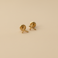 Aretes de oro cruz profesional