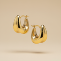 Aretes de oro tipo argolla gruesa - Foto profesional