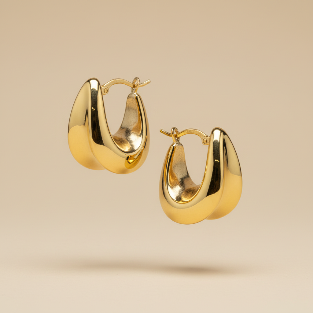 Aretes de oro tipo argolla gruesa - Foto profesional