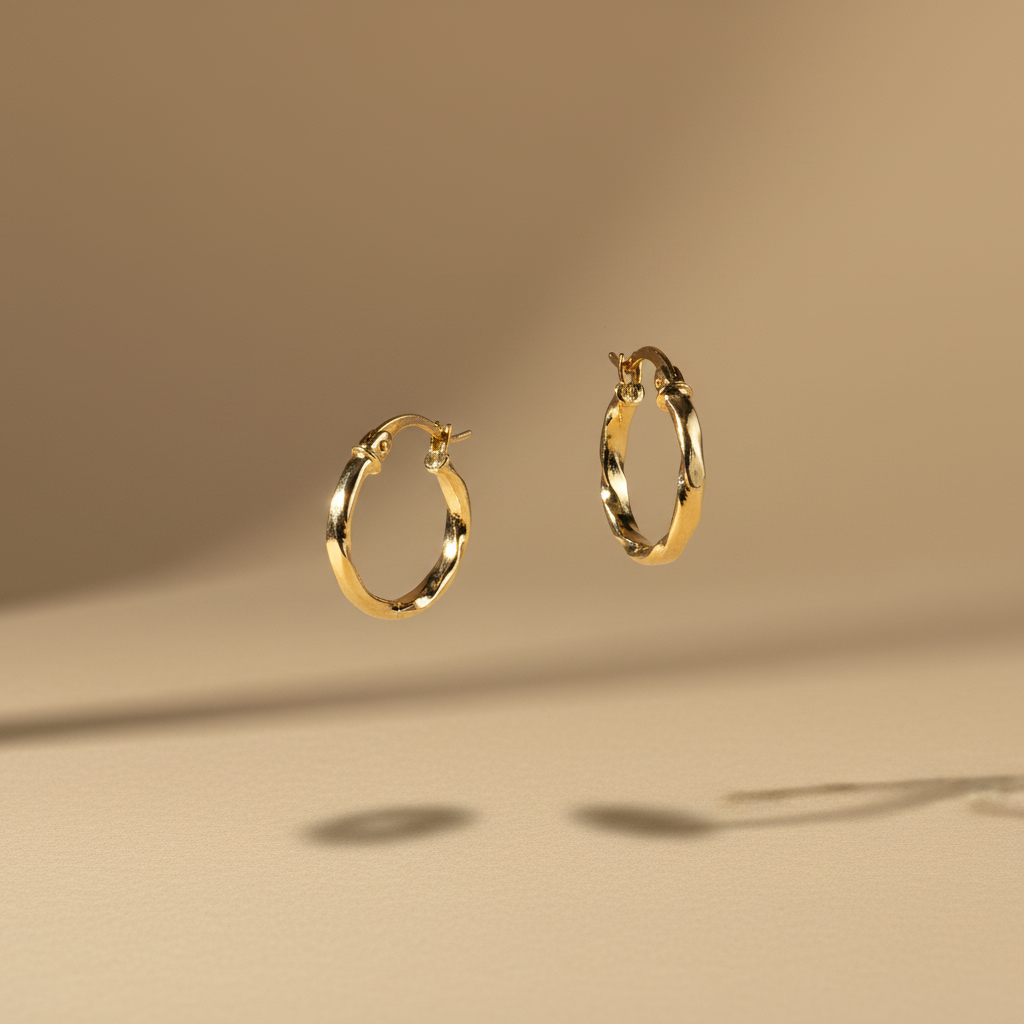 Aretes de oro trenzados flotantes - Fondo beige