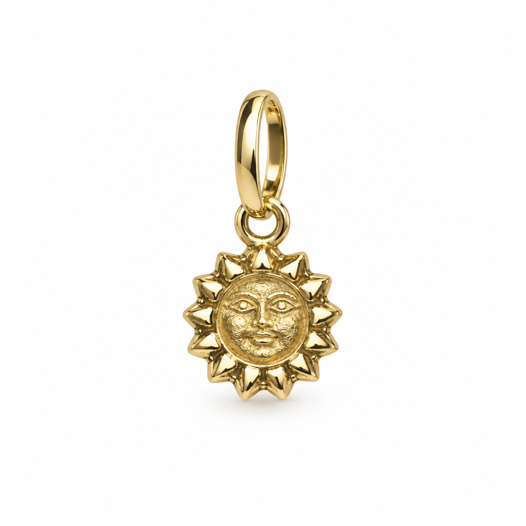 Dije de sol dorado sobre fondo blanco