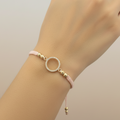 Pulsera Tejida Ciclo on delicate hand