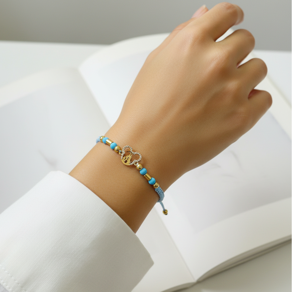 Pulsera tejida dreams en mano - fiel al original