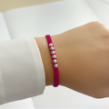 Pulsera tejida element en mano