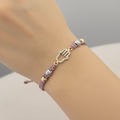 Pulsera tejida mano on delicate hand